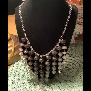 Beaded necklace grey black necklace falls to point very pretty.